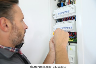 Electrician Fixing Electric Panel In Private Home