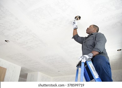 An electrician fixing wires