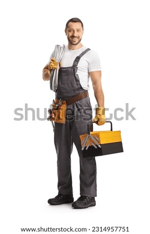 Electrician holding cables and a tool box isolated on white background
