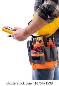 Electrician Holds Multimeter Tester In Hand, Helmet With Protective Goggles. Construction Industry, Electrical System. Isolated On A White Background.