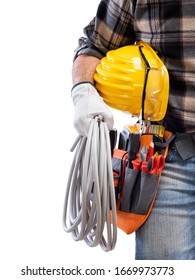 Electrician Holds The Roll Of Electric Cable In His Hand, Helmet With Protective Goggles. Construction Industry, Electrical System. Isolated On A White Background.