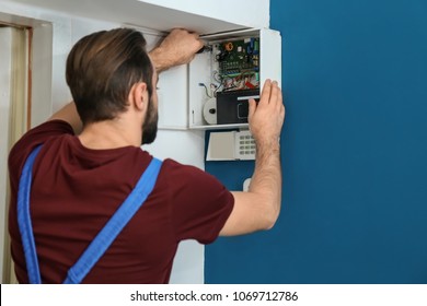 Electrician Installing Alarm System