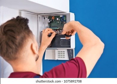 Electrician Installing Alarm System