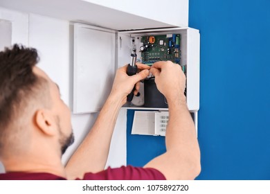 Electrician Installing Alarm System