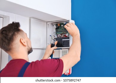 Electrician Installing Alarm System