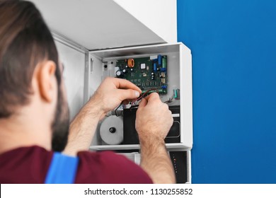 Electrician Installing Alarm System