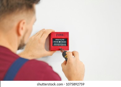 Electrician Installing Fire Alarm System