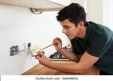 Electrician Installing Socket In New House