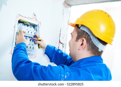 Electrician Installing Switching Electric Actuator In Fuse Box