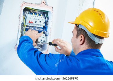 Electrician Installing Switching Electric Actuator In Fuse Box