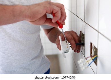 Electrician Installing Wall Socket