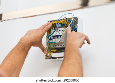 Electrician Man Installing Electric Fuse At Home.