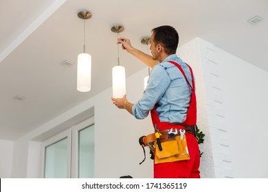 Electrician Man Worker Installing Ceiling Lamp