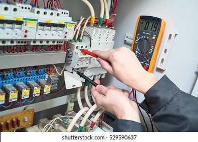 electrician measurements with multimeter tester
