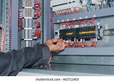 Electrician Near The Low-voltage Cabinet. Uninterrupted Power Supply. Electricity.