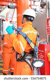 Electrician Operator With Safety Harness Inspect And Checking Fire And Gas Detection. Fire And Gas Detection Monitoring System In Hazardous Area In Oil And Gas Central Processing Platform.