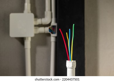 Electrician repair wire in PVC Conduit , renovate home .