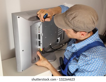 Electrician Repairing A TV