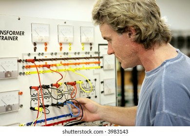 An Electrician Taking Continuing Education Class To Learn About Transformers.  Focus On Student's Face.