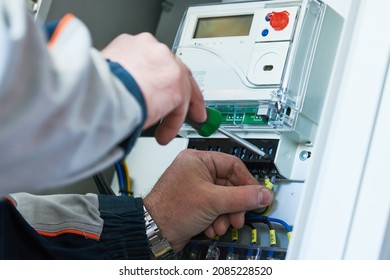 Electrician work  Installing electricity counter in switchbox  current breaker installation