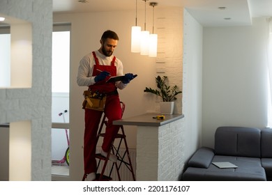 Electrician Worker Installation Electric Lamps Light Inside Apartment. Construction Decoration Concept.