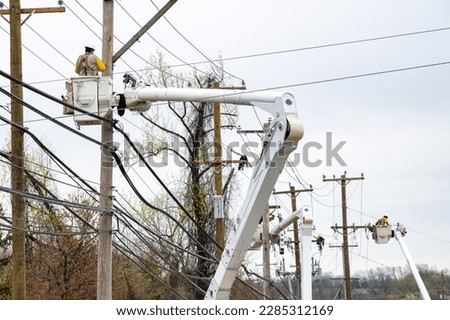electrician worker work on fixing and changing by being in crane electricians on a crane line power helmet