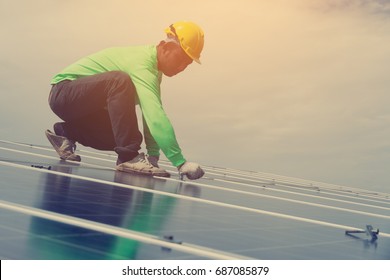 electrician working on  maintenance equipment at solar power plant; electrician swapping  solar panel with solar panel voltage drop
 - Shutterstock ID 687085879