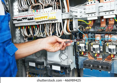 Electrician Works With Electric Meter Tester In Fuse Box