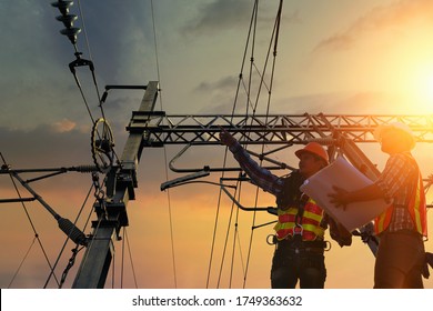 Electricians are climbing on electric poles to install and repair power lines.electricians work with high voltage electricity.