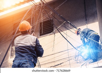 Electricians are dismantling the wiring from the building.The electrician made a bad mistake and was electrocuted.Electrical system development.Technician cutting cable.