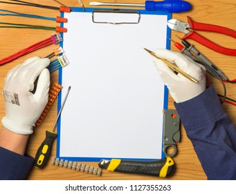 Electricians fills in on the tool background - Powered by Shutterstock