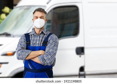 Electricians Repairman Or Plumber Near Van Car In Face Mask