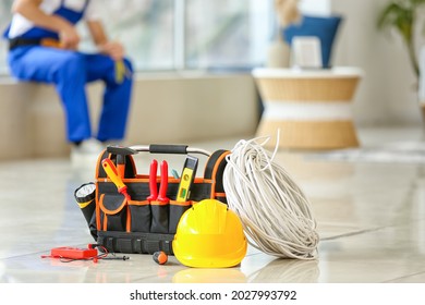 Electrician's tools on floor in room - Powered by Shutterstock