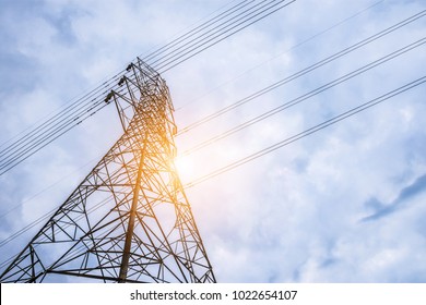 Electricity concept, Close up high voltage power lines station.  High voltage electric transmission pylon silhouetted  tower.