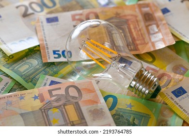 Electricity cost. light bulb on euro bills.Rising electricity prices in Europe.Crisis of energy production in the EU countries.Increasing the cost of light and heat.Saving electricity concept
