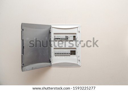 Electricity distribution box. Fusebox. Isolated on apartment wall