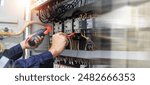 Electricity and electrical maintenance service, Engineer hand holding AC voltmeter checking electric current voltage at circuit breaker terminal and cable 