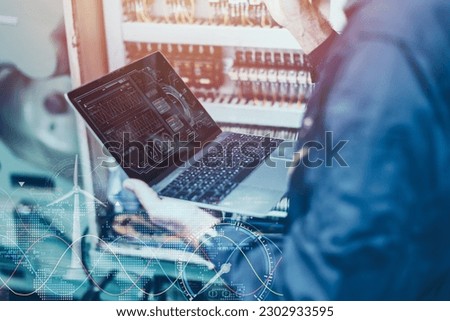 Electricity engineer work using AI computer software control monitor power consumption saving energy concept