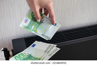 Electricity European Energy Gas Crisis Bill Goes Up, Money Banknotes At Winter Home. High Prices On Warm Heat Radiator. Consumption Concept With A Warm Toggle Bar.