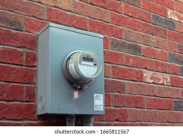 Electricity Hydro Power Electric Energy Smart Meter On The Brick Wall