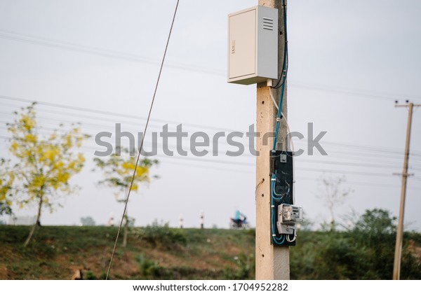 Electricity meter picture of Thailand. Electric\
pole with electricity\
meter