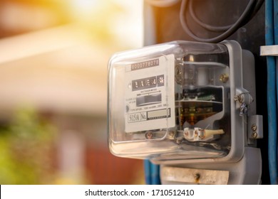 Electricity meters for home electrical appliances, including blurred natural green backgrounds, electric power usage concepts, and electricity usage audits. - Shutterstock ID 1710512410
