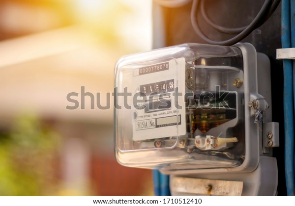 Electricity meters for home electrical\
appliances, including blurred natural green backgrounds, electric\
power usage concepts, and electricity usage\
audits.