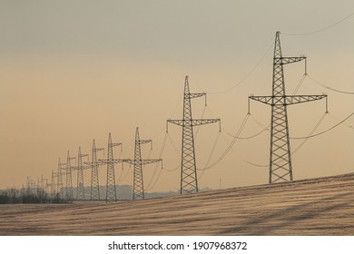 Electricity pillars in the fields during cold winter in Belarus