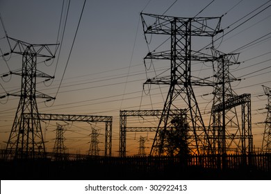 Electricity Poles At Sunset In Soweto, A Township Of Johannesburg In South Africa. 
