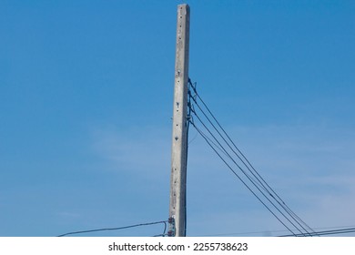 electricity post with blue sky background, power pole in Thailand. - Shutterstock ID 2255738623