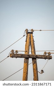 electricity post with blue sky background, power line and electricity pole.electricity post with blue sky background, power transmission and distribution concept. - Shutterstock ID 2311867171
