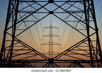 Electricity pylon (Strommasten) also overhead line pylon  Construction forms windows  Winter evening 