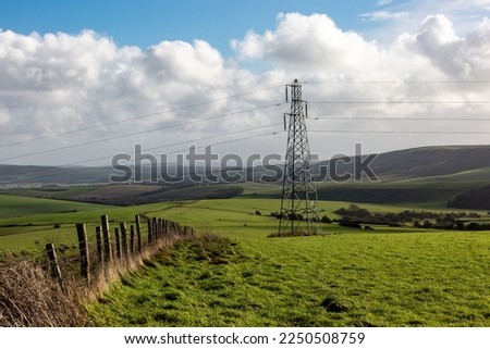 An electricity pylon in the Sussex countryside, on a sunny Winter's day