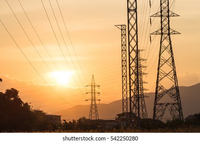 Electricity pylons and lines at sunset - Powered by Shutterstock